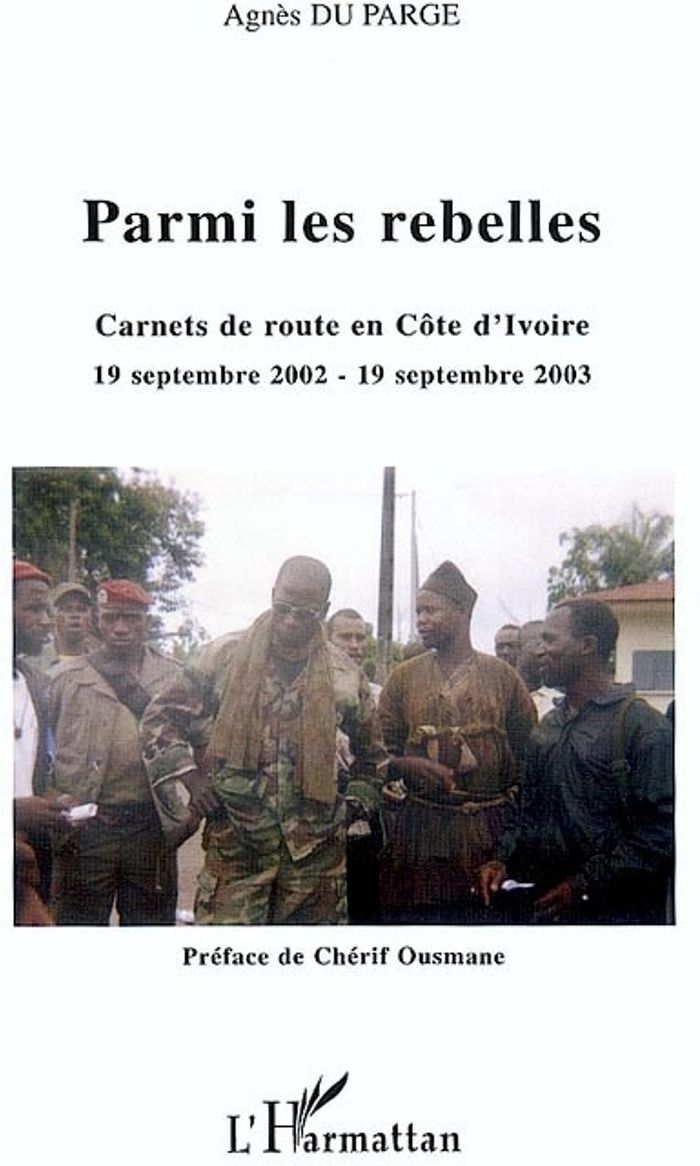 Couverture du livre « PARMI LES REBELLES - CARNETS DE ROUTE EN COTE D'IVOIRE 19 SEPTEMBRE 2002 - 19 SEPTEMBRE 2003 », librairie Les Contes Infusés à Corte